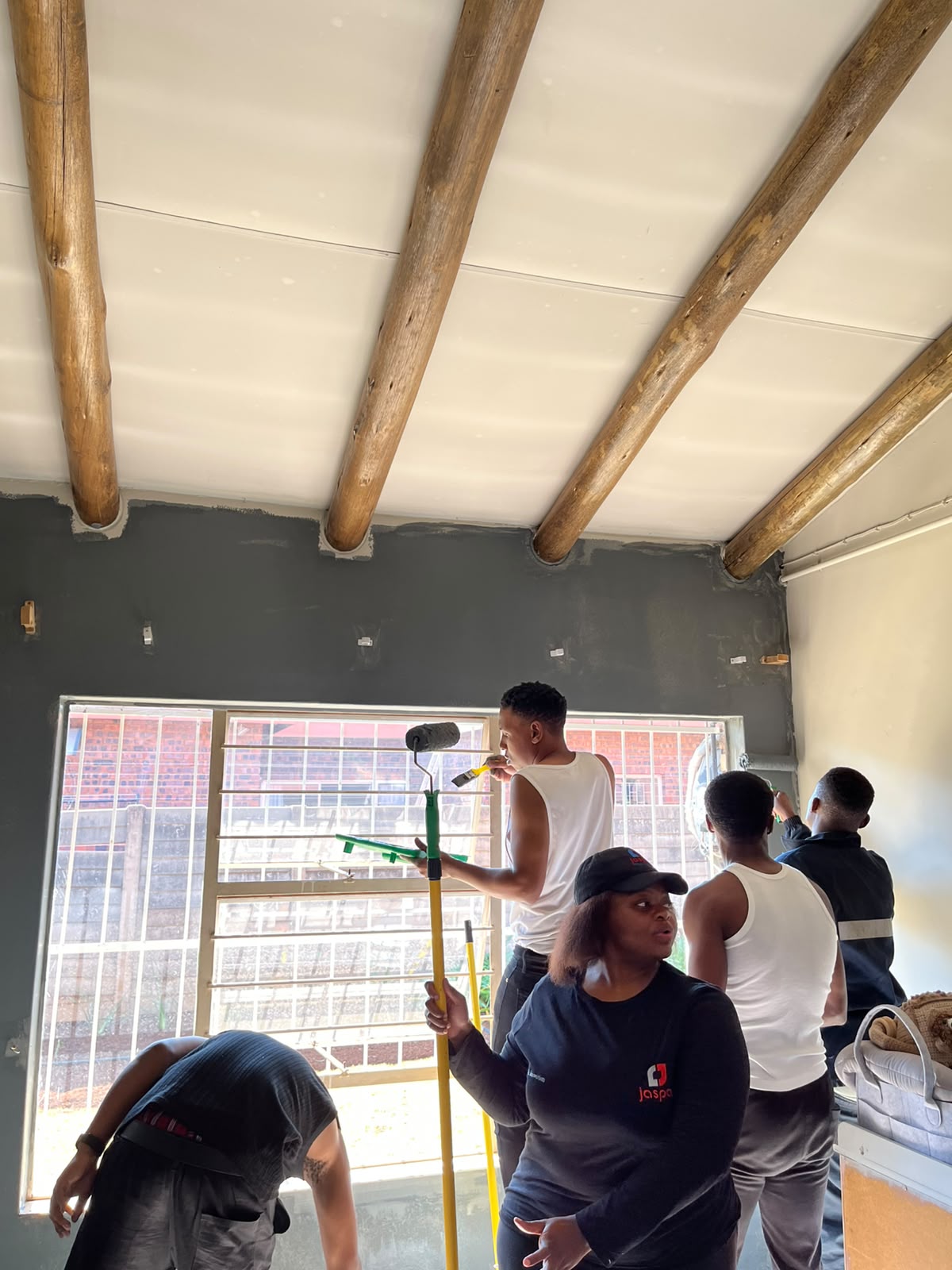 Transforming the space: team paints the NPO facility